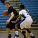 Dexter High School senior Brandon Bellottie tries to dribble against a Lincoln defender on Tuesday, Jan. 29. Daniel Brenner I AnnArbor.com
